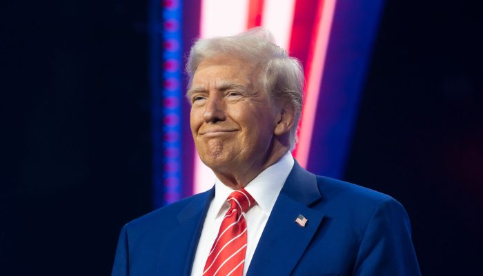 PHOENIX, ARIZONA - DECEMBER 22: U.S. President-elect Donald Trump smiles during Turning Point USA's AmericaFest at the Phoenix Convention Center on December 22, 2024 in Phoenix, Arizona. The annual four day conference geared toward energizing and connecting conservative youth hosts some of the country's leading conservative politicians and activists. (Photo by Rebecca Noble/Getty Images)